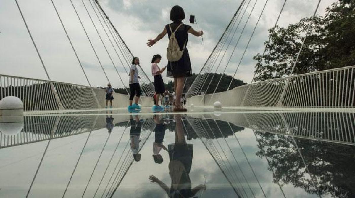 Worlds highest and longest glass bridge opens in China